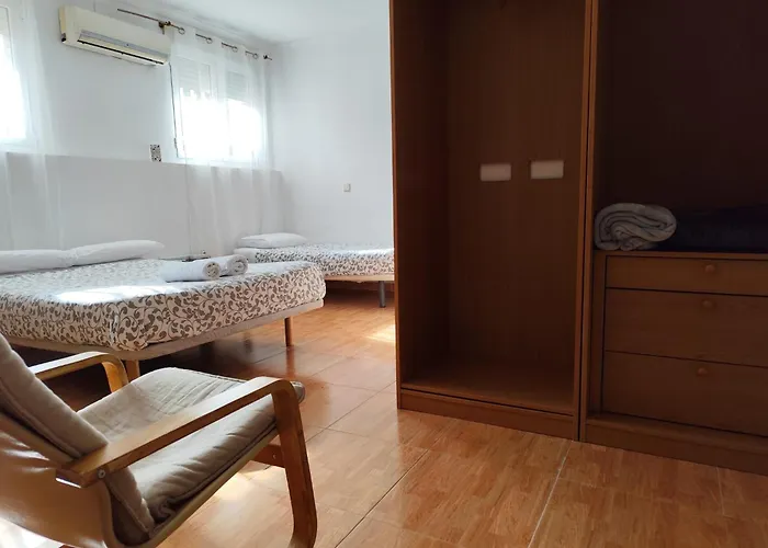 Hotel que admite mascotas: Apartamento y Habitaciones El Colmenar